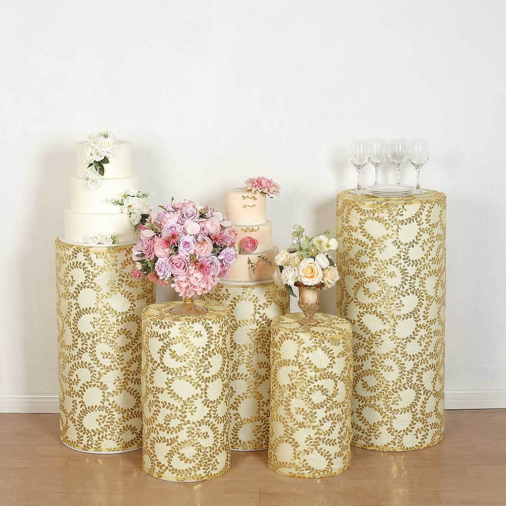 http://www.efavormart.com/cdn/shop/files/Set-of-Gold-Sequin-Mesh-Cylinder-Plinth-Display-Box-Stand-Covers-with-Leaf-Vine-Embroidery-4_1024x1024.jpg?v=1703202167