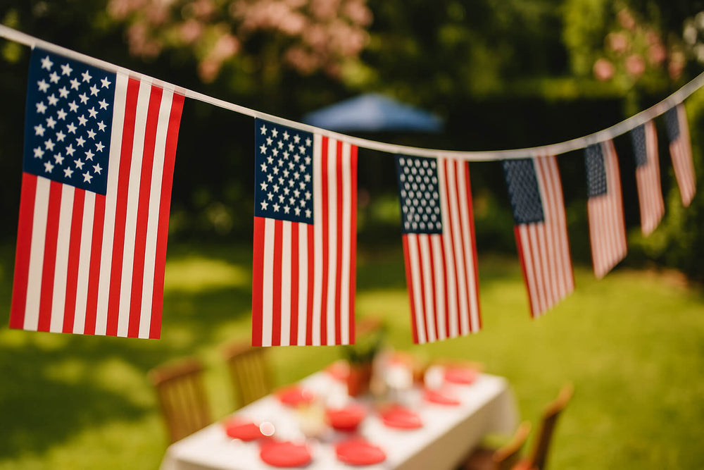 American flag bunting above outdoor table for a Memorial Day party celebration