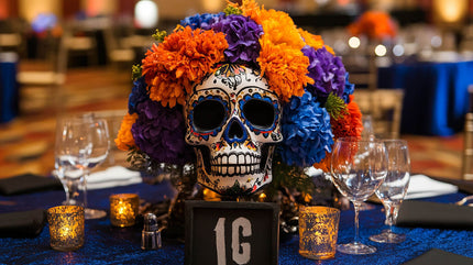 Vibrant Dia de los Muertos decor centerpiece featuring a colorful skull and marigolds, perfect for a festive party table setting.