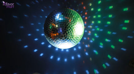 Close-up of a disco ball reflecting colorful lights in a dark room for a lively effect.