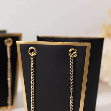 <span style="background-color:transparent;color:#000000;">Black Gold Edge Paper Favor Bags With Metal Chain Handles For Any Occasion</span>