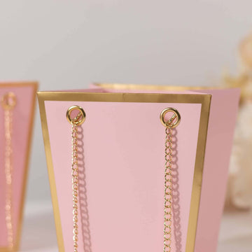 <span style="background-color:transparent;color:#000000;">Pink Gold Edge Paper Favor Bags With Metal Chain Handles For Any Occasion</span>