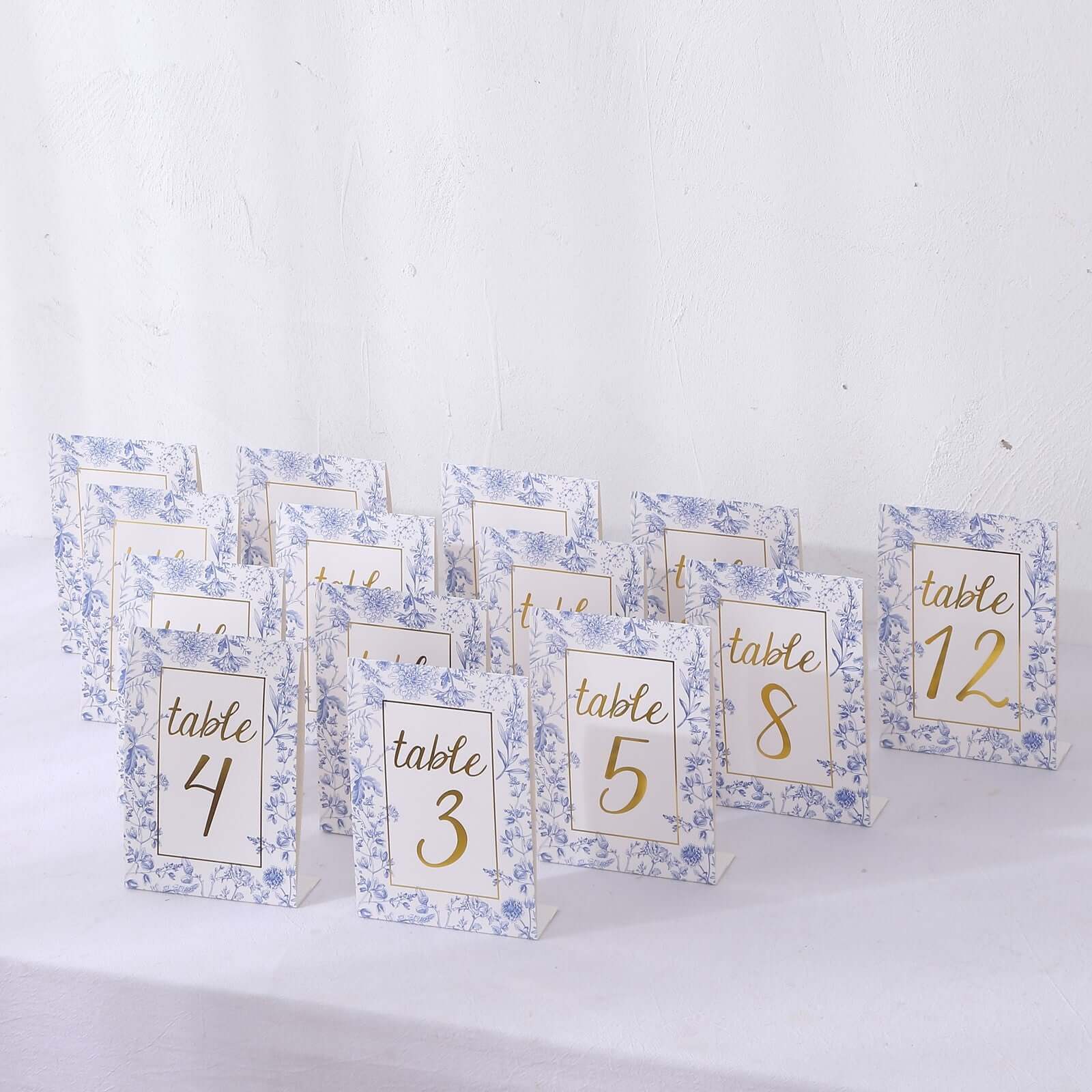 https://www.efavormart.com/cdn/shop/files/Pack-White-Blue-Double-Sided-Paper-Wedding-Table-Numbers-With-Chinoiserie-Floral-and-Gold-Numbers-Print-7.jpg?v=1699552892