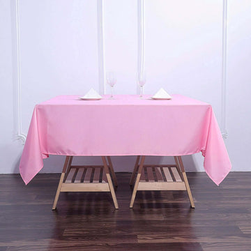 Add Elegance to Your Event with the Pink Square Seamless Polyester Table Overlay 70"x70"