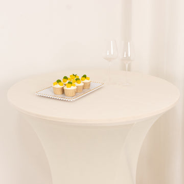 <span style="background-color:transparent;color:#000000;">Versatile Ivory Spandex Cocktail Table Cover</span>