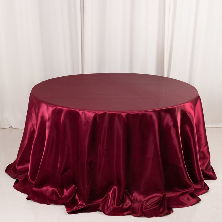 Burgundy Seamless Satin Round Tablecloth 132inch for 6 Foot Table With Floor-Length Drop