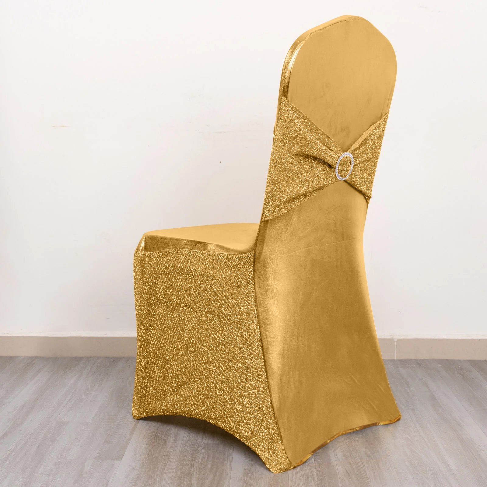https://www.efavormart.com/cdn/shop/files/metallic-gold-shimmer-tinsel-spande-banquet-chair-cover-with-attached-sash-band-and-round-silver-rhinestone-buckle-efmt.jpg?v=1694075437
