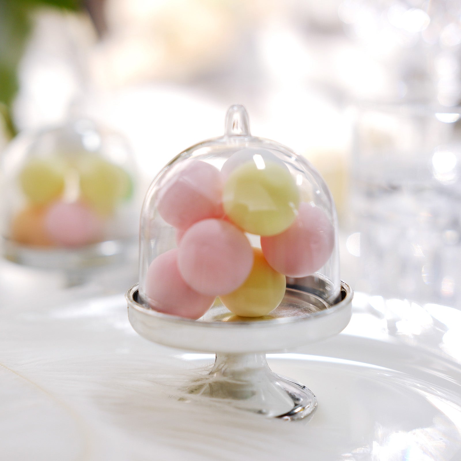 https://www.efavormart.com/cdn/shop/products/12-Pack-3--Clear-Silver-Fillable-Mini-Pedestal-Cake-Stand-Gift-Boes-Candy-Treat-Favor-Boes-With-Dome-Lid.jpg?v=1689407012