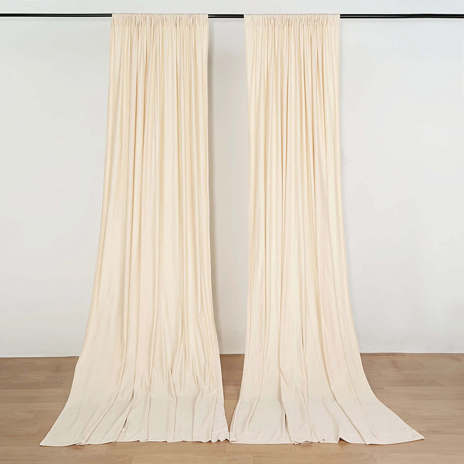 https://www.efavormart.com/cdn/shop/products/Beige-Fire-Retardant-Scuba-Polyester-Curtain-Panel-Backdrops-Wrinkle-Free-With-Rod-Pockets.jpg?v=1689406611