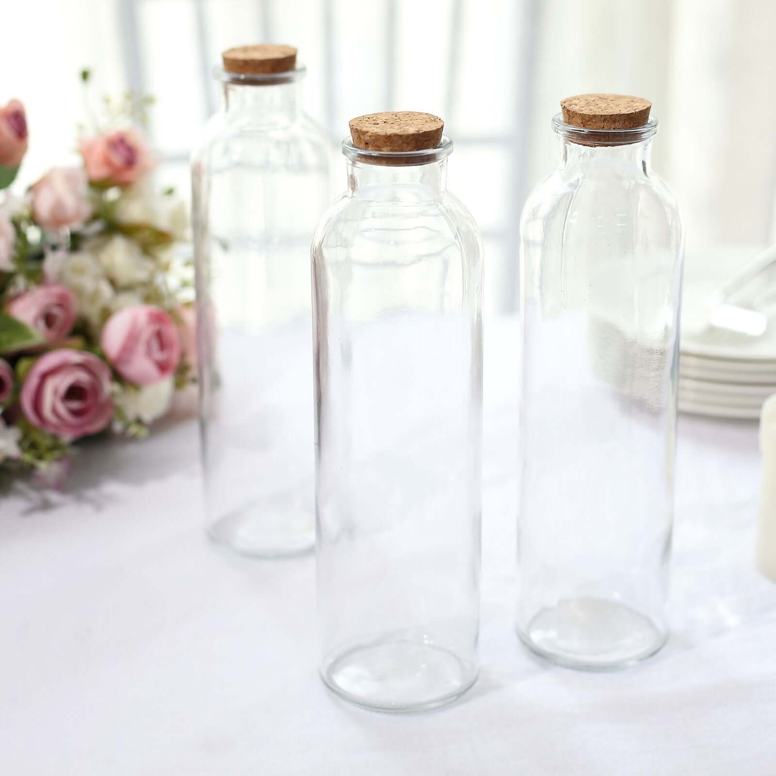 https://www.efavormart.com/cdn/shop/products/Clear-Round-Glass-Storage-Jars-With-Cork-Stoppers.jpg?v=1689407965