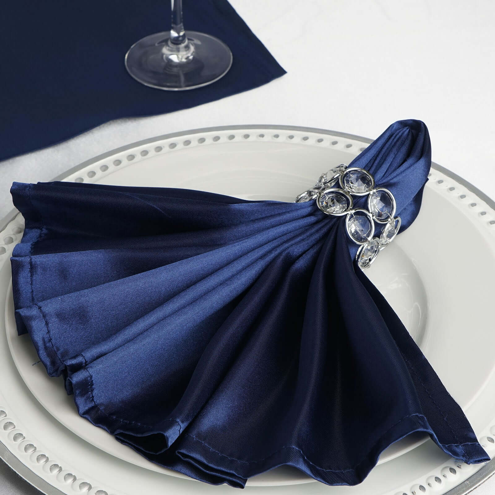 https://www.efavormart.com/cdn/shop/products/Navy-Blue-Seamless-Satin-Cloth-Dinner-Napkins.jpg?v=1689405015