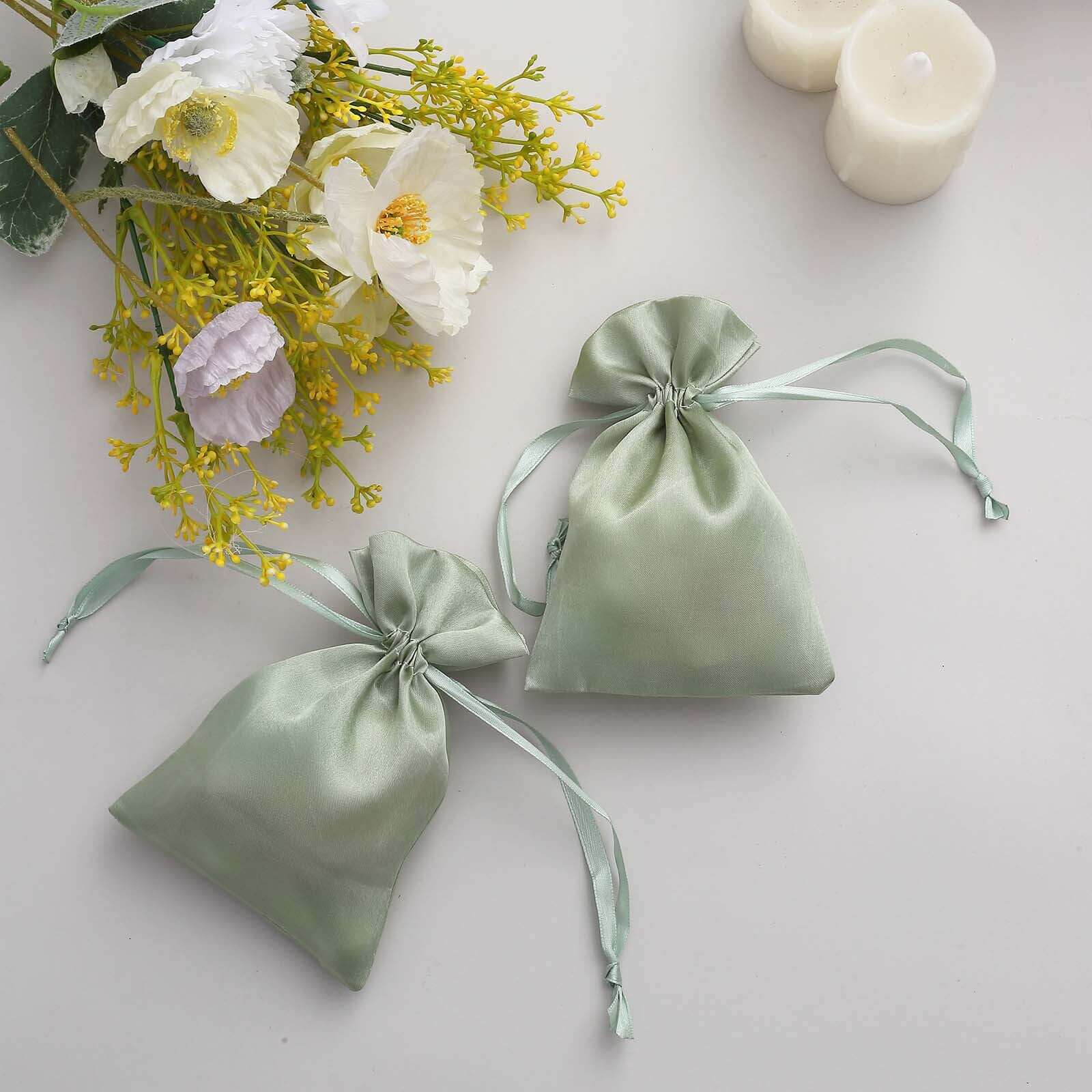 https://www.efavormart.com/cdn/shop/products/Sage-Green-Satin-Drawstring-Wedding-Party-Favor-Gift-Bags.jpg?v=1689408053