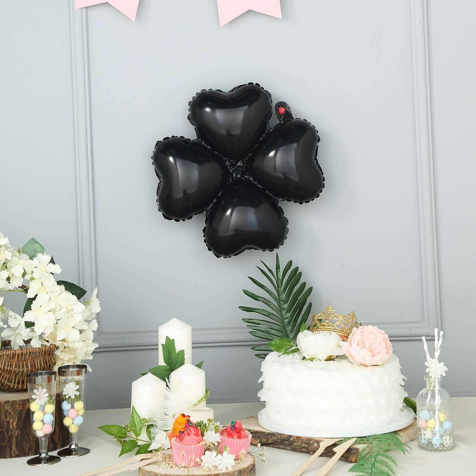 https://www.efavormart.com/cdn/shop/products/Shiny-Black-Four-Leaf-Clover-Shaped-Mylar-Foil-Balloons.JPG?v=1689406082